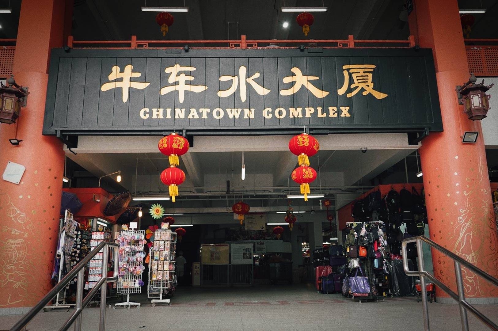 Bustling Chinatown marketplace with cultural decor.