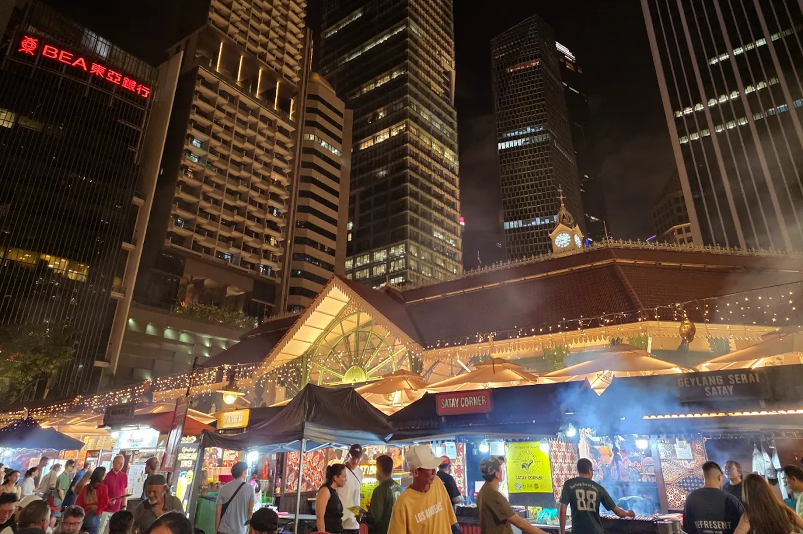 Approach to Lau Pa Sat—ironwork, street edge, daylight held at the entrance