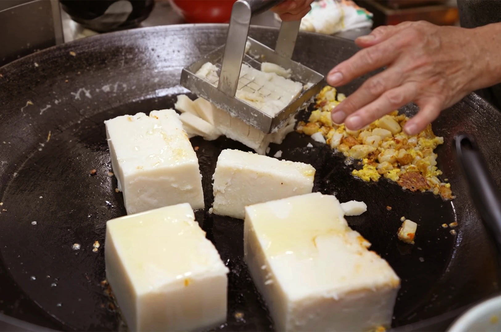 Carrot cake on the griddle—pieces separated across the cooking surface