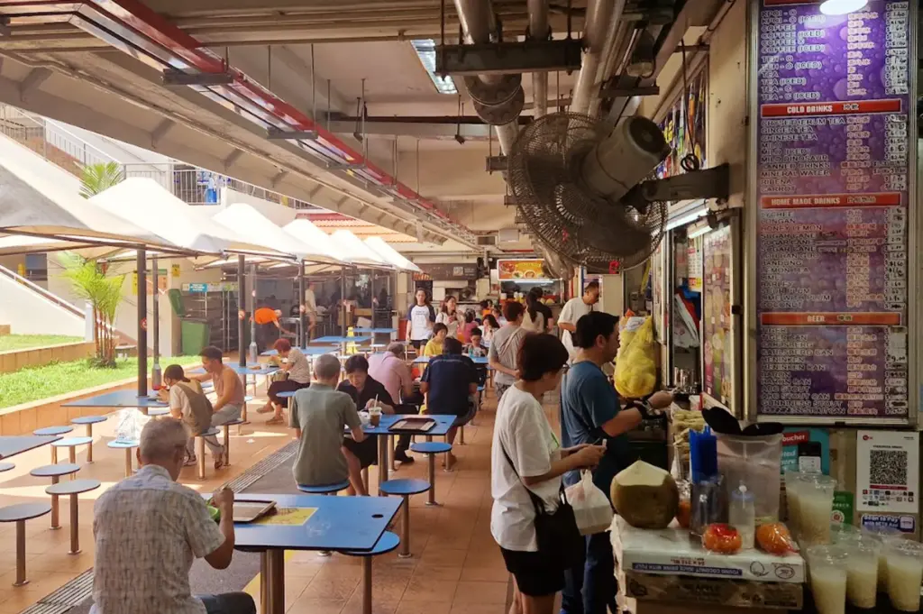 Golden Mile Food Centre—rows of stalls, quieter table rhythm
