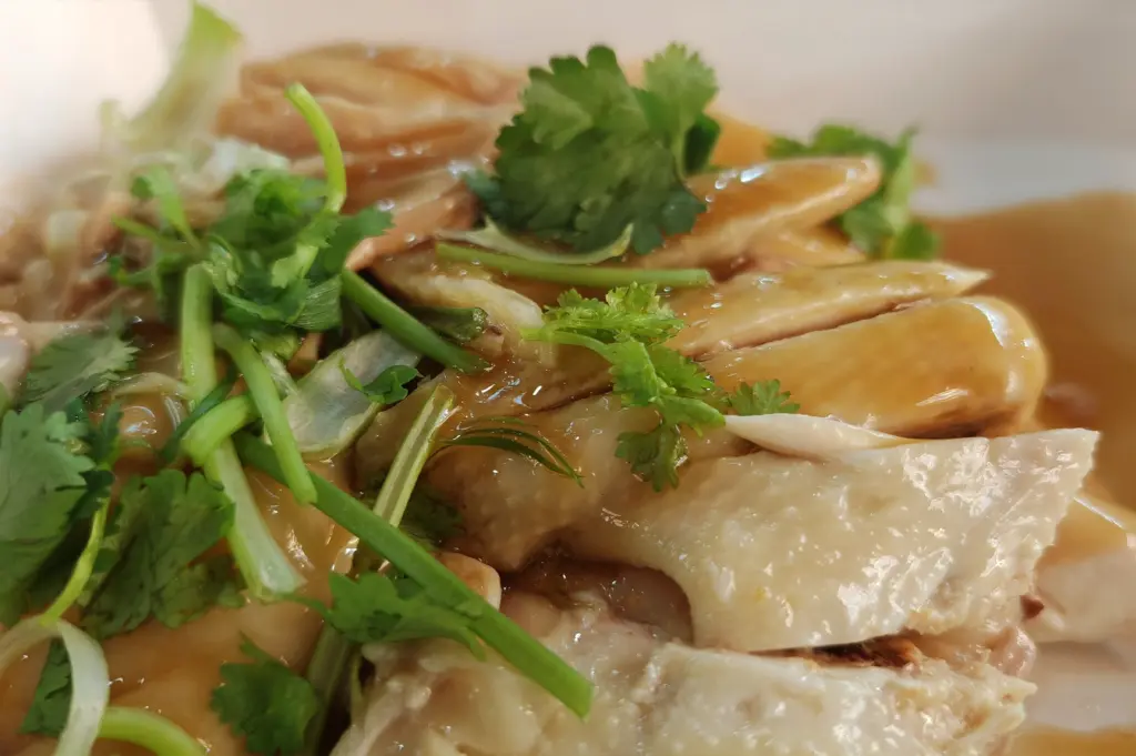 Close view of the rice and chicken, surfaces holding the last traces of heat.