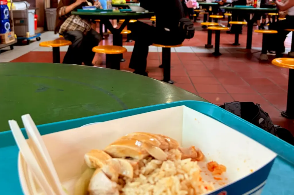 The food awaits the first bite—while conversation continues nearby.