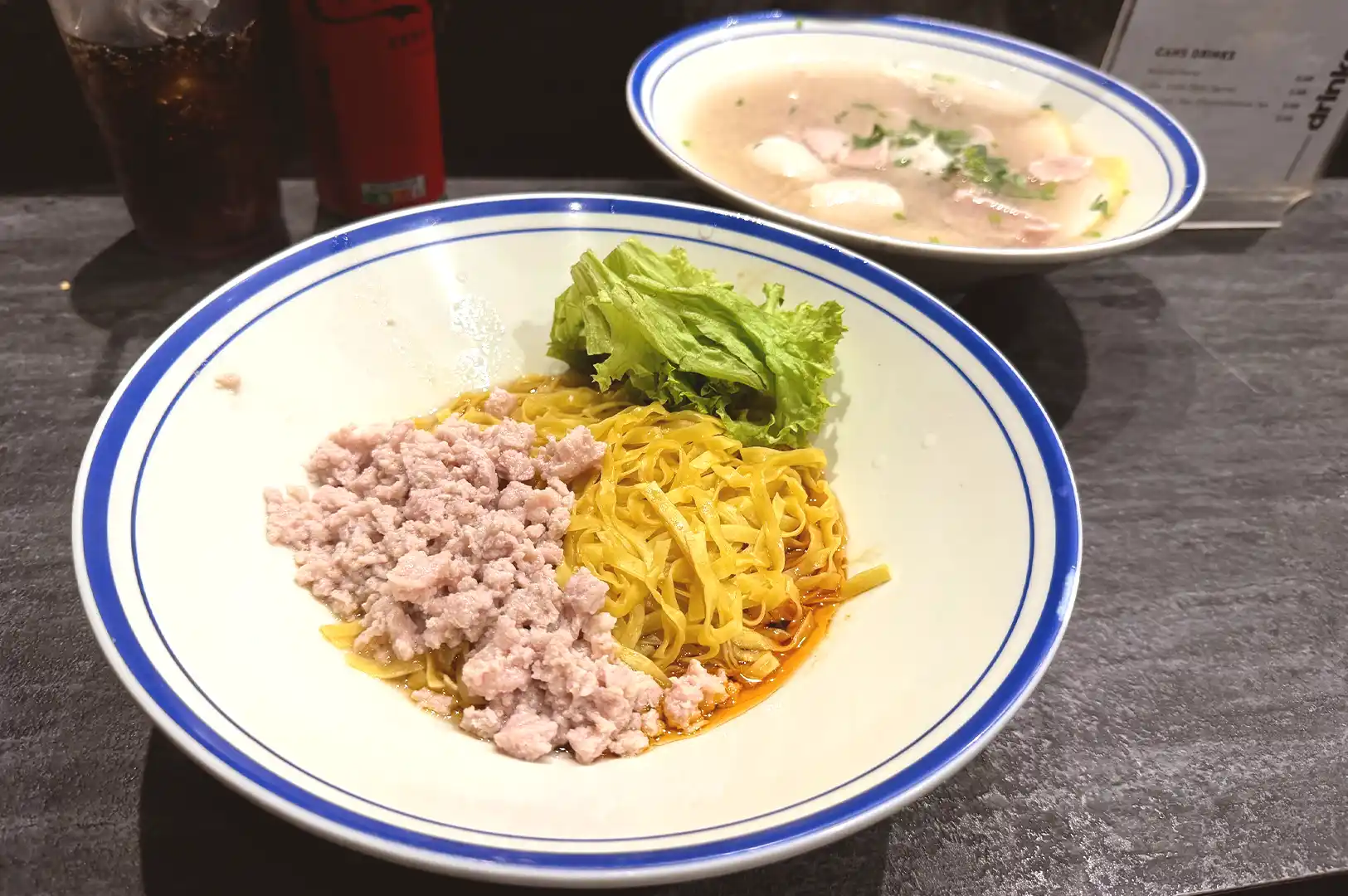 Bak chor mee resting on a table, noodles and toppings settling into place