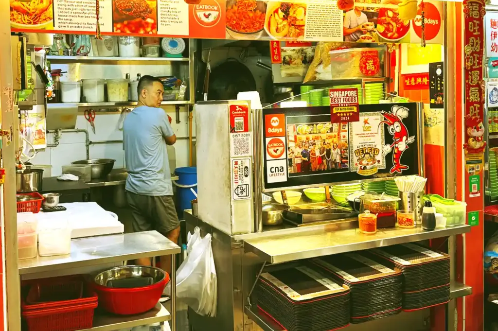 Hawkers working behind counters during service.